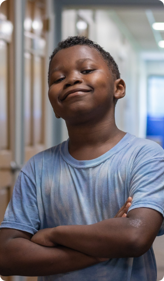Image of a child posing confidently